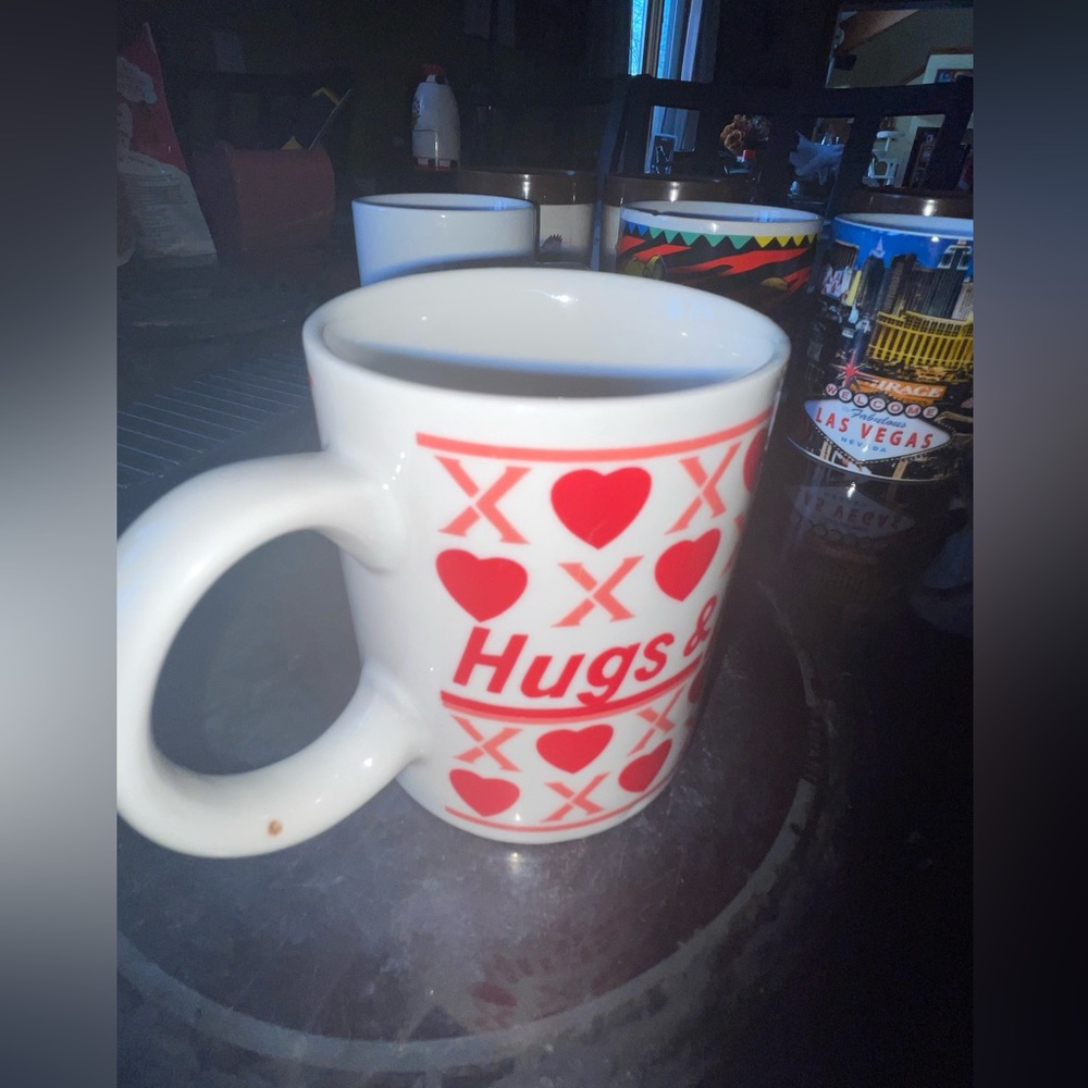 Coffee cup with CDs and heart.